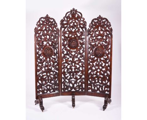 A Chinese carved hardwood three-fold room screen, Qing Dynasty, late 19th centuryEach panel of arch-top form and carved in hi