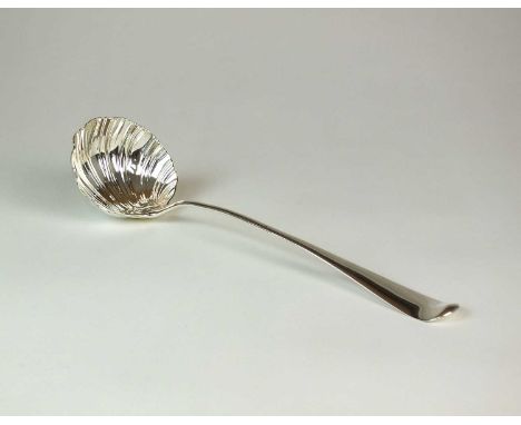 An early George III Hanoverian pattern silver soup ladle, W C, London 1761, with shell moulded bowl and engraved crest to the