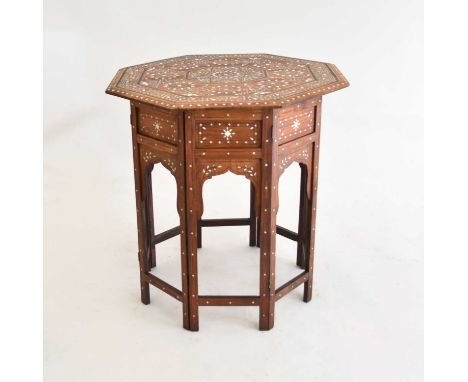 A late 19th/early 20th century Indian octagonal occasional table, probably teak, inlaid with bone and stringing, the centre i