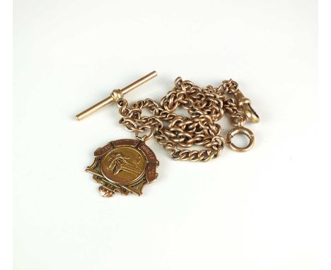 A 9ct rose gold Albert, the graduated curb links with attached T-bar, swivel and bolt ring, suspending yellow metal 'Billiard