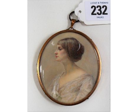 Early 20th Century British portrait miniature on ivory depicting the profile of a young woman in white dress, the back signed