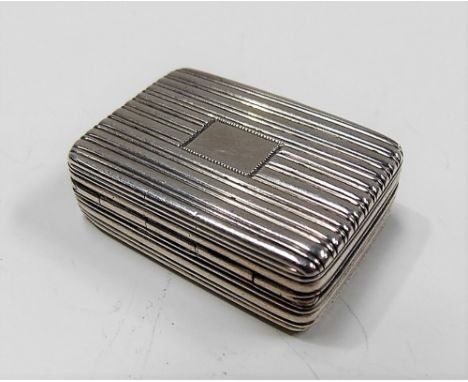 George IV silver vinaigrettes of rectangular engine turned form, hinged to reveal a foliate pierced grill, maker JL, London 1
