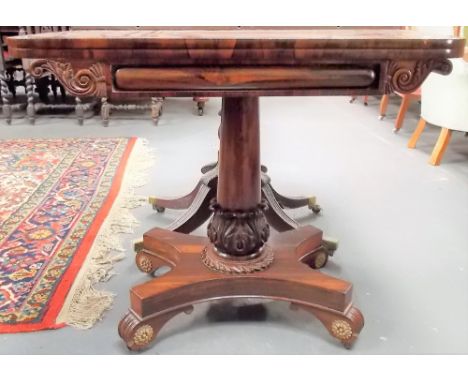 Regency rosewood card table, the rectangular hinged swivel top with green baize inset over the column pedestal with stiff lea