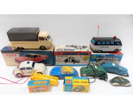 Collection of vintage toy vehicles including three Japanese within original boxes, a Corgi Volkswagen European police car No.