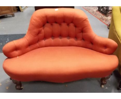 Victorian button back upholstered two seat settee with shaped back and on carved cabriole forelegs with ceramic castors, widt