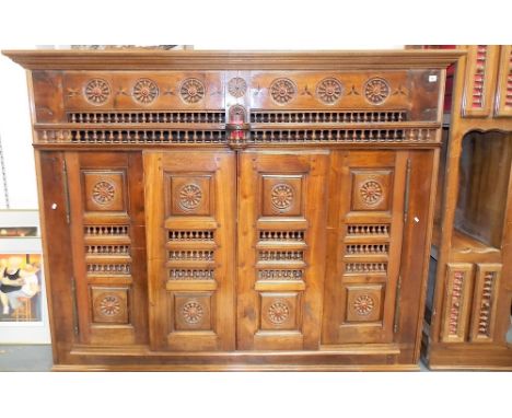 Reclaimed teak bacon cupboard, the moulded cornice over eight boxwood and ebony inlaid star motifs and six circular panels wi