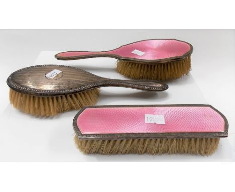 George V silver and pink guilloche enamel hair and clothes brush together with another silver hair brush (3)