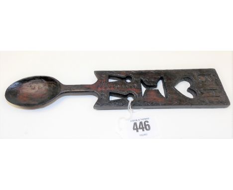Antique Welsh love spoon, the pierced and carved handle with monogram B.H. over a heart, cup and two keys, length 24.25cm.