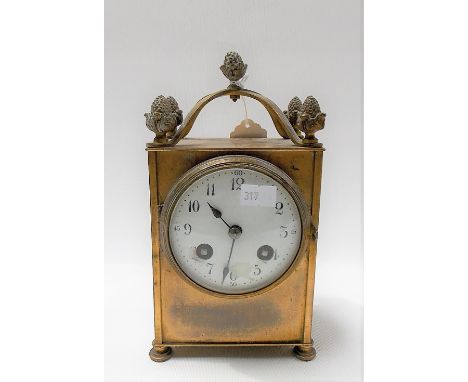 French two train brass carriage-style clock with glass sides, the 3in white enamel dial with Arabic numerals, the French move