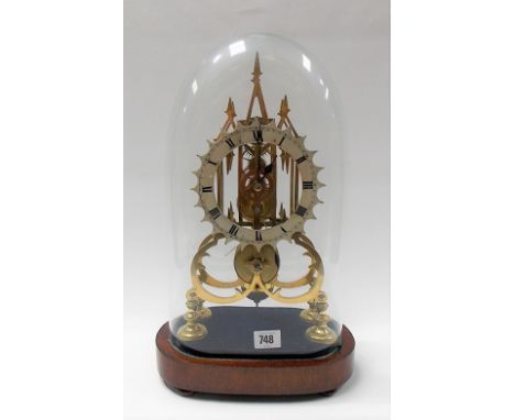 Single fusee skeleton timepiece with cream enamel painted 6in dial with black Roman numerals and under a glass dome and venee