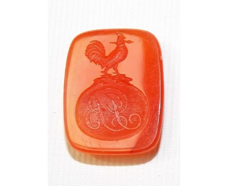 Intaglio cut agate of rectangular form with cockerel over monogram design, length 21mm approx.