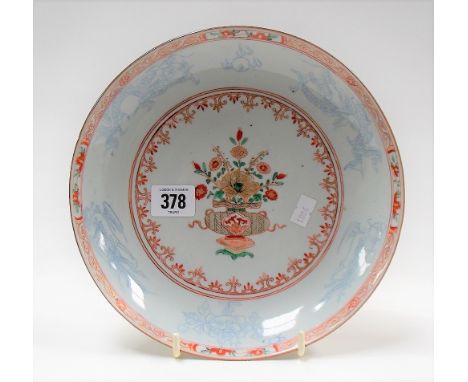 Chinese porcelain enamel decorated shallow bowl, the centre decorated with a vase issuing flowers, the rim with dragons and p