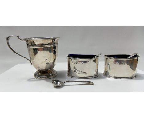 A silver pedestal Christening cup, Birmingham 1954 (af) together with a pair of silver oval salts with blue glass liners toge