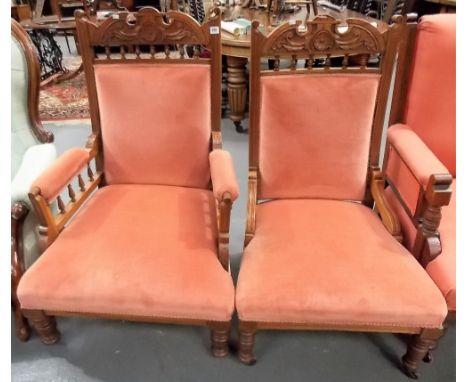 Pair of Victorian walnut framed and upholstered ladies' and gentlemen's salon chairs upon turned forelegs with ceramic castor