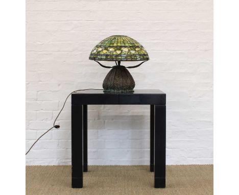 Art Nouveau-Style Bronze Table Lamp In the Manner of Tiffany With stained shade raised on heavy cast base with foliate patter