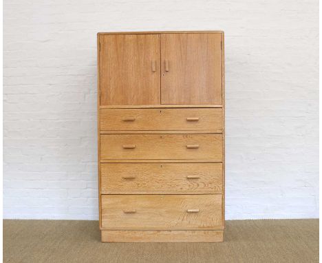 Heal's of London Art Deco Limed Oak Tallboy Circa 1930, with twin cupboard doors above four graduated drawers, set with geome