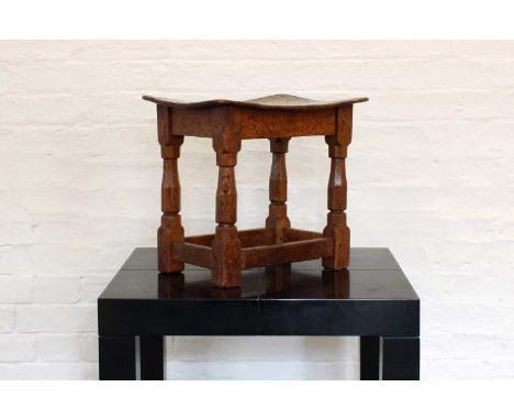 Robert "Mouseman" Thompson of Kilburn Early and Rare Oak Joint Stool Circa 1930, the pollard oak top raised on shaped column 