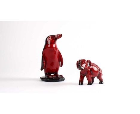 Charles Noke for Royal Doulton Flambe Penguin Figure Circa 1920, signed with printed mark to base, together with a flambe ele