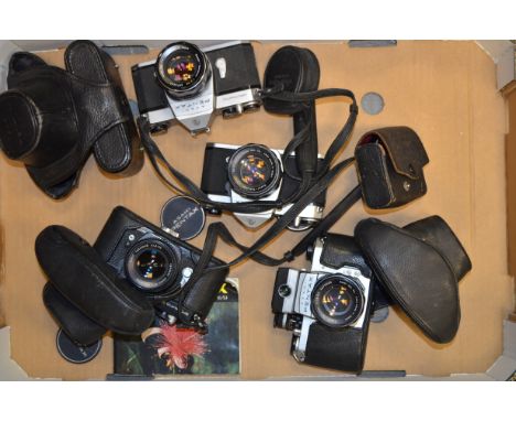 A Tray of Pentax SLRs,  examples include a S1a with metered prism, a SP II,  a black SP F and a SP1000, all with 55mm Super T