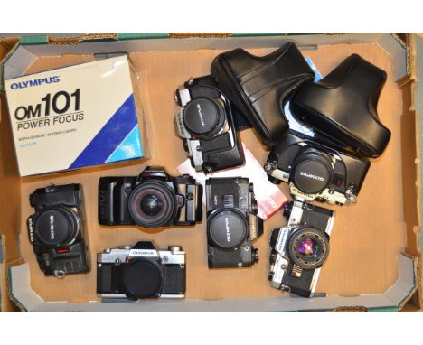 A Tray of Olympus OM SLR Cameras,  including OM10, OM30, OM40 and OM101, most examples with lenses and maker's cases