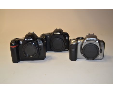 A Tray of DSLR Bodies,  a Canon EOS 20D, 300D and a Nikon D70s