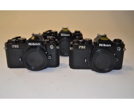 Nikon FE2 SLR Camera Bodies,  (3) black examples, with body caps 