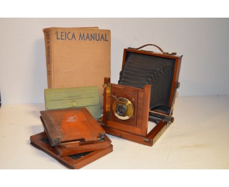 A Mahogany and Brass Quarter Plate Camera, unmarked, f/8-32 lens marked T B I, three DDS, a Morgan &Lester Leica manual and T