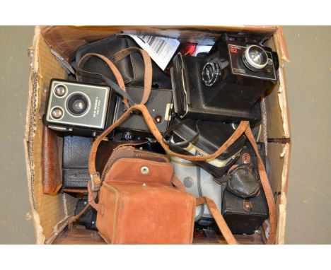 A Tray of Kodak Cameras, including Instamatics, Brownies, a Cine camera and Polaroids3 polaroid cameras inc. LAN camera 1000,