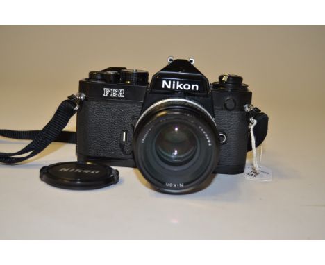 A Nikon FE2 SLR Camera,  serial no. 23925449, black, shutter working, body, G-VG, with a Nikkor 50mm f/1.8 lens, no. 325862, 