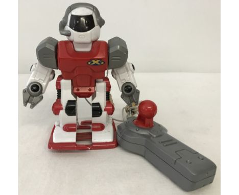 A 1990's wired remote control robot walking toy. With forward and reverse action. 