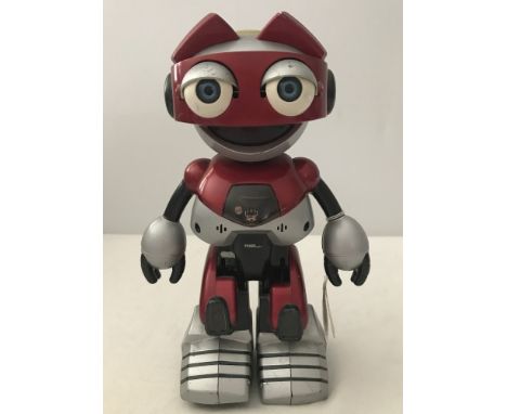 A 2001 Tiger Electronics red and silver interactive robot toy. With moving, flashing and audio parts. Approx. 25cm tall.