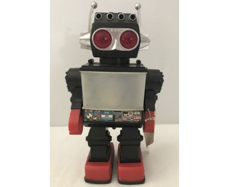 A 1980's Jupiter Robot toy made in China by Kamco. With flashing eyes, walking action and space scene on his "TV"  screen. 4 