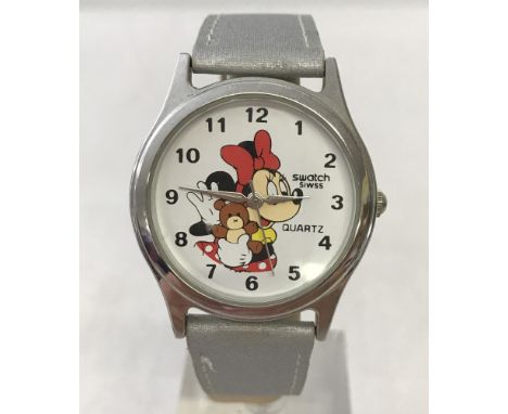 A Minnie mouse holding  teddy bear wrist watch by Swatch. Back stamped TM&C 2000 Warner Bros, Looney Tunes. On silver P.U str