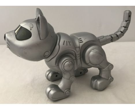 A 2001 Manley Quest interactive robotic cat with moveable legs, tail and head. Light up eyes and audio sounds. 