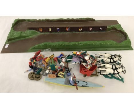 A collection of Timpo plastic soldiers with Knight's jousting play base. Figures comprise:- Arabs, Mexicans, Knights, Cowboys