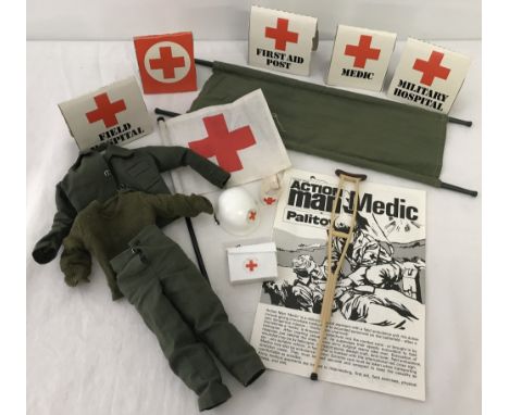 A vintage action man Medic outfit, accessories and leaflet. Comprising jumper, shirt, trousers, helmet, arm band, crutch, med