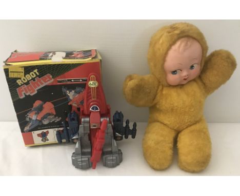 A boxed vintage Robot Fighter together with a furry body Kewpie style doll.  