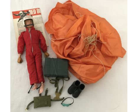 A vintage 1964 Red devils Action Man with outfit, accessories and pamphlet. Comprising red jumpsuit, visor goggles,  orange p