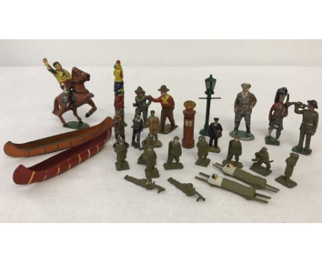 A collection of vintage lead toy soldiers & railway figures. To include Dinky post box and postman, gas lamp post, cowboys & 