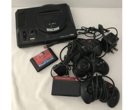 A vintage Sega Mega Drive 16-bit console complete with leads. Together with 3 official Sega controls and 3 game cartridges. 