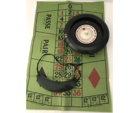 A boxed vintage home roulette game by K.&C. LTD., London. Complete with original dealers visor. 