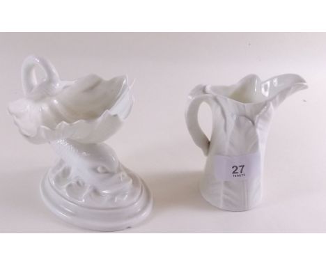A Royal Worcester white dolphin and shell bon bon dish and a leaf jug 