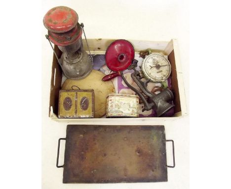 A box of kitchenalia including mincer and Tilly lamp, scales and a brass and iron griddle plate 