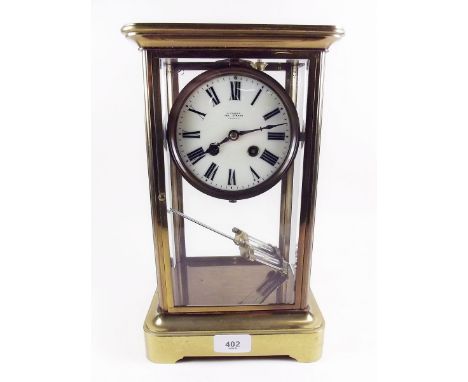A late 19th century brass mounted four glass mantel clock by S Fisher with mercury compensated pendulum
