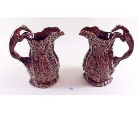 A pair of Victorian brown glazed hunting jugs with greyhound handles 