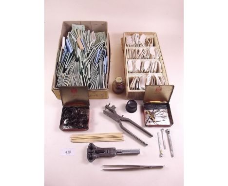 A quantity of watch glasses and watch tools 