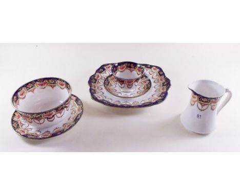 A Royal Albert Edwardian tea service comprising:- seven cups and six saucers, twelve tea plates, two cake plates, jug and sug