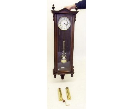 A Vienna style mahogany wall clock with enamel dial and glazed case