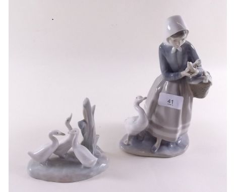 A Lladro group goose girl and a goose group 