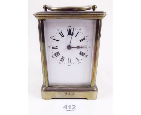A brass cased carriage clock and key